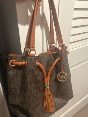 Michael Kors Brown Monogram Drawstring Tote with Tan Leather Trim